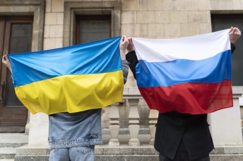 back-view-citizens-with-russian-ukrainian-flag