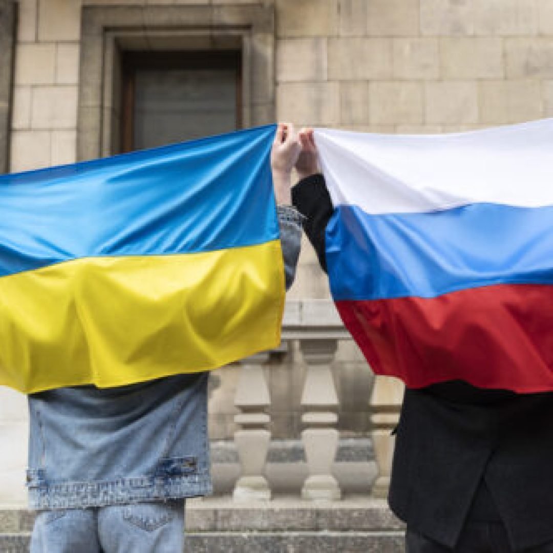 back-view-citizens-with-russian-ukrainian-flag